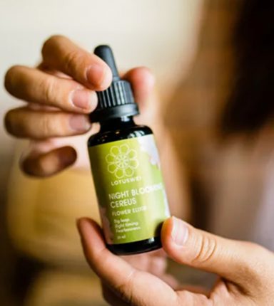 lotus wei essential oils in a womans hands
