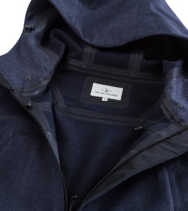navy jacket open and showing the lost explorer label