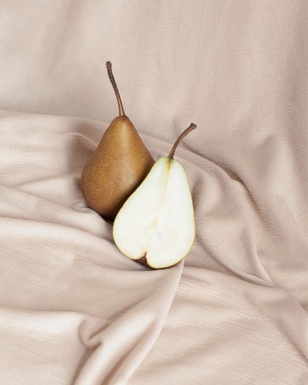 Pears nestled in a beige cloth